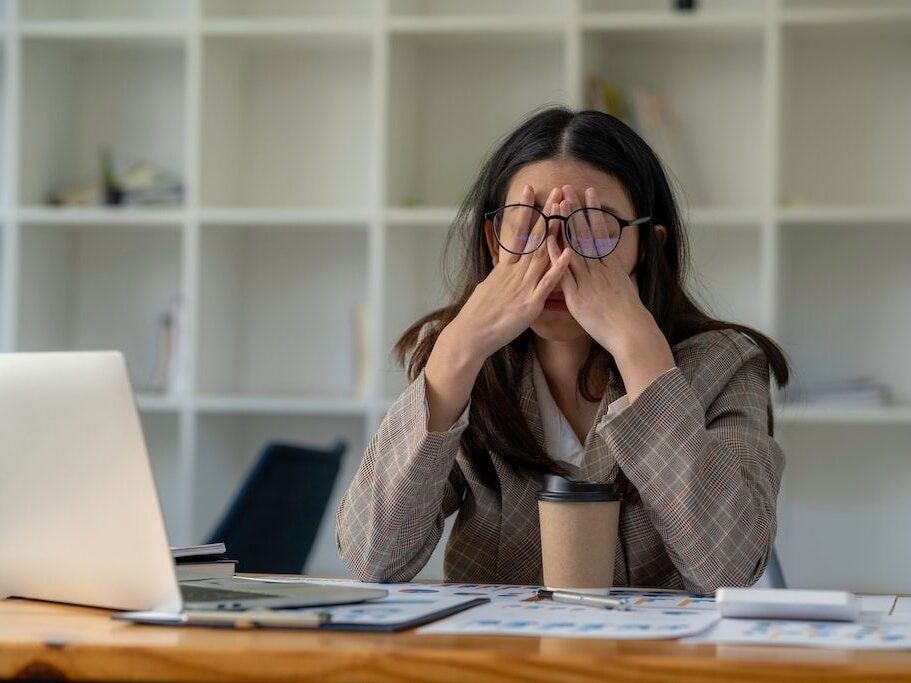 Tired,business,woman,sleepy,and,bored,from,sitting,at,a